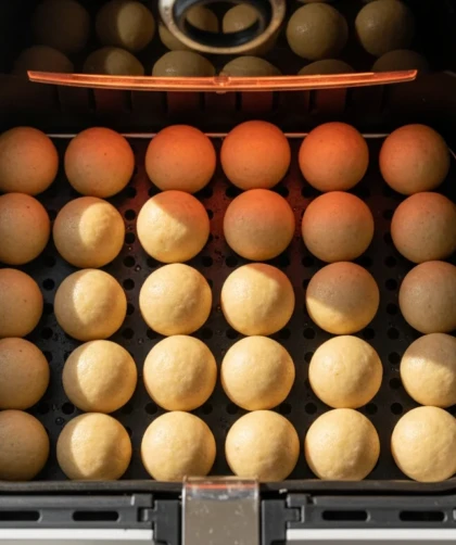 Cardamom air fryer donut holes with saffron-lemon glaze, pistachio, and rose.